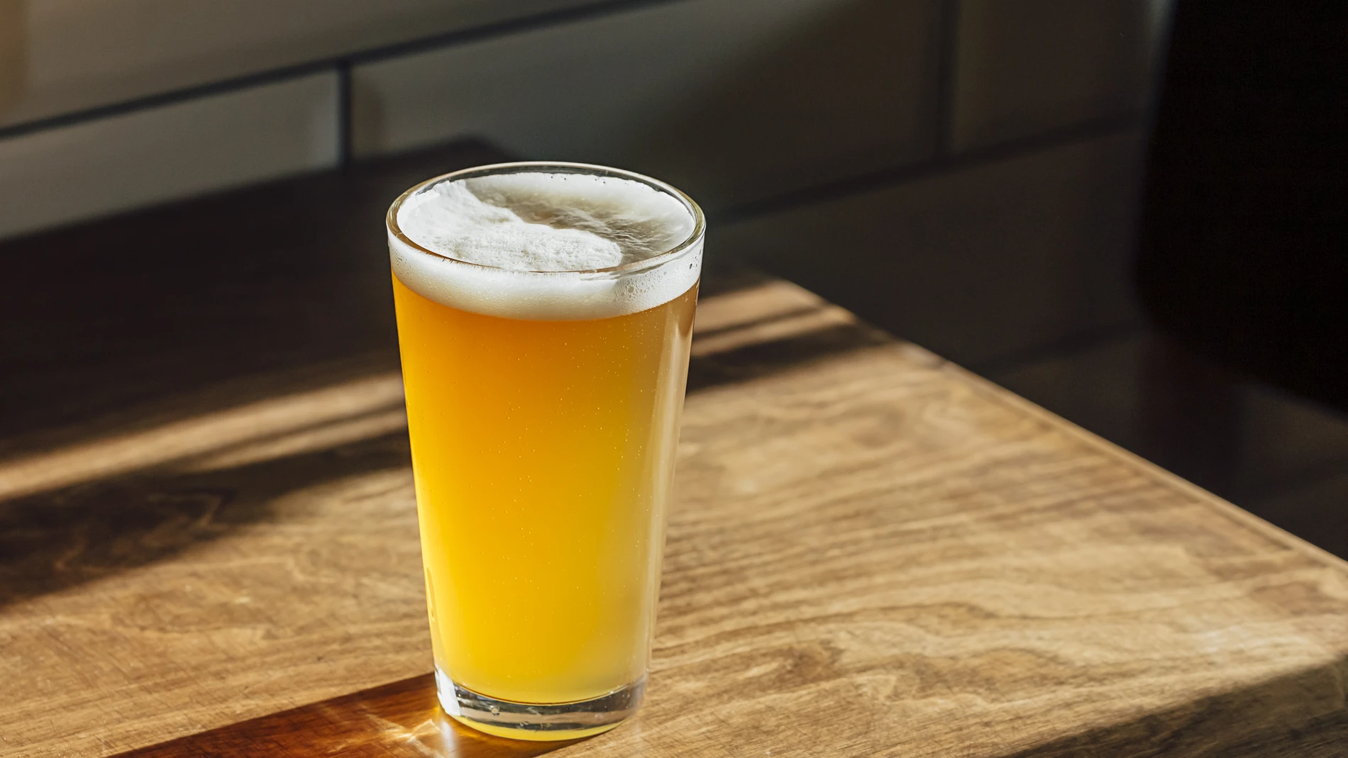 Beer on a wooden table light from window