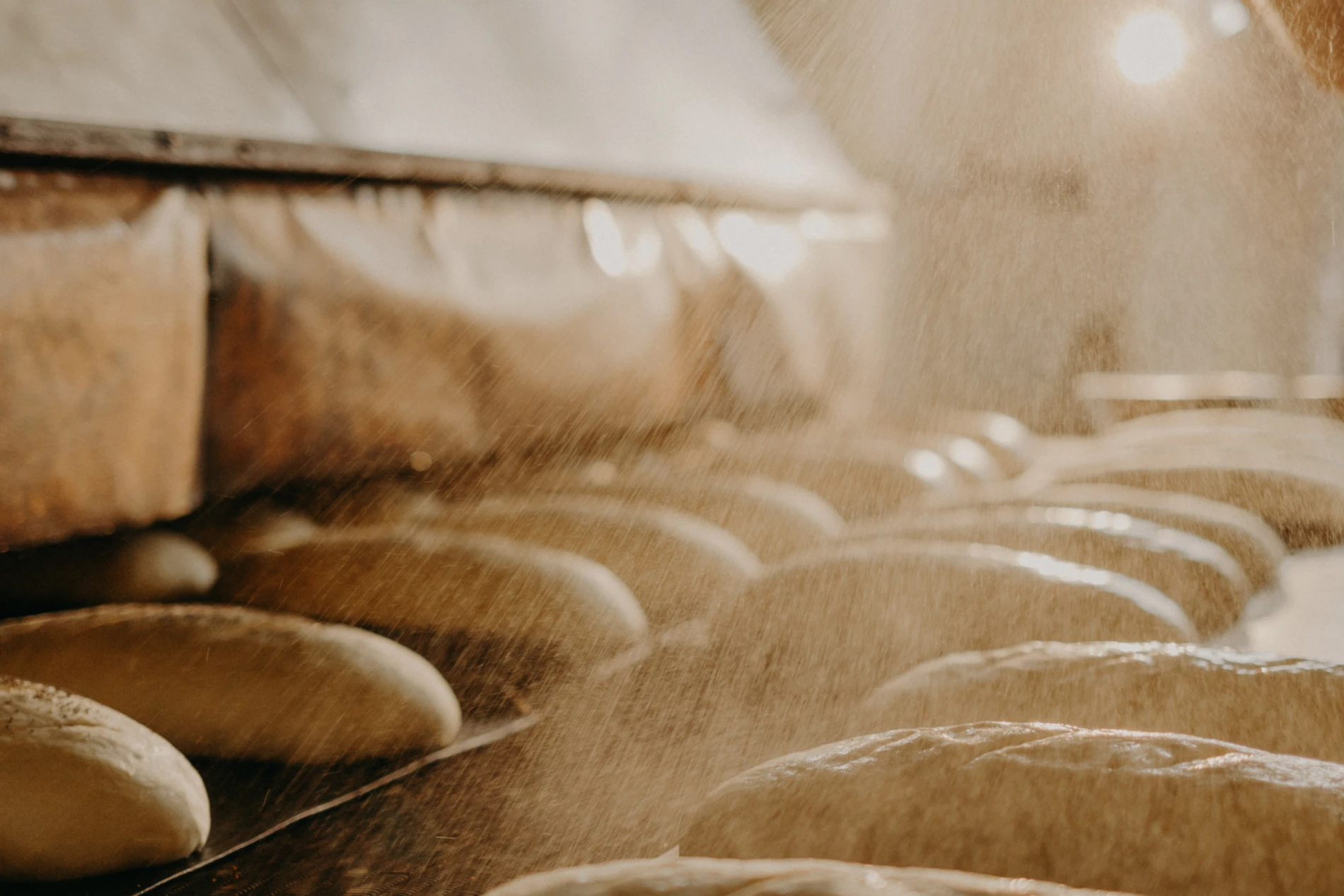 Flour poured on loaves of bread 