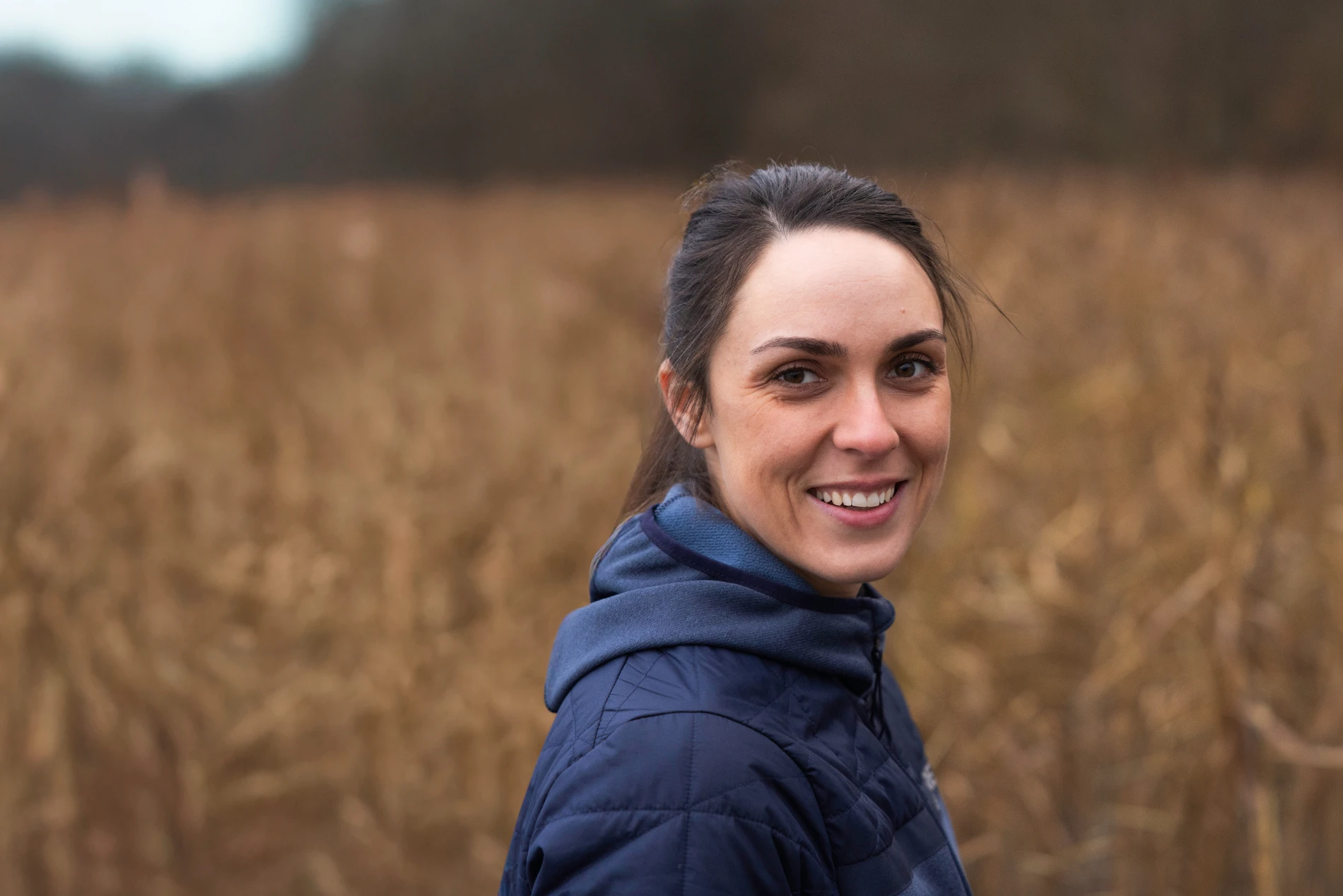 Brunette girl smiling towards the camera