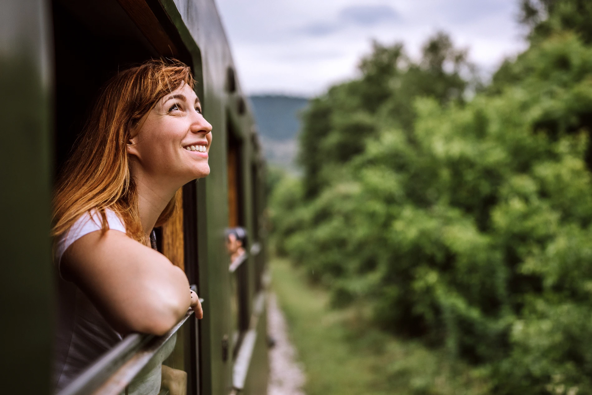 woman looking out of train window