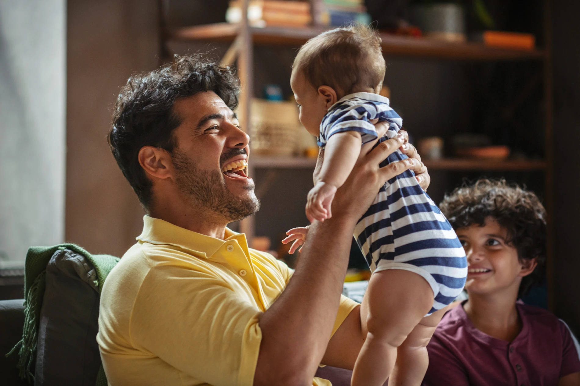 dad playing with baby
