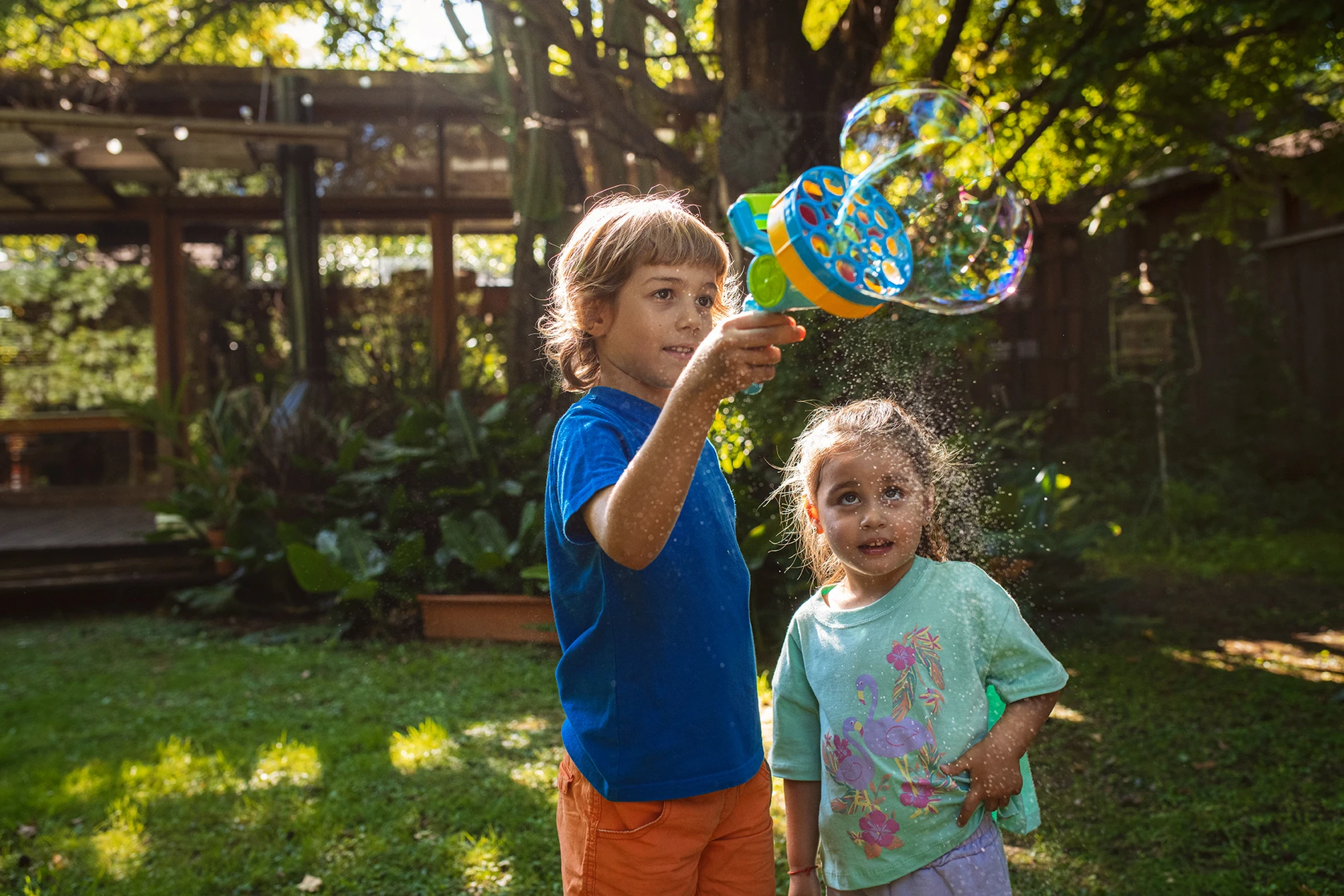 siblings playing bubbles