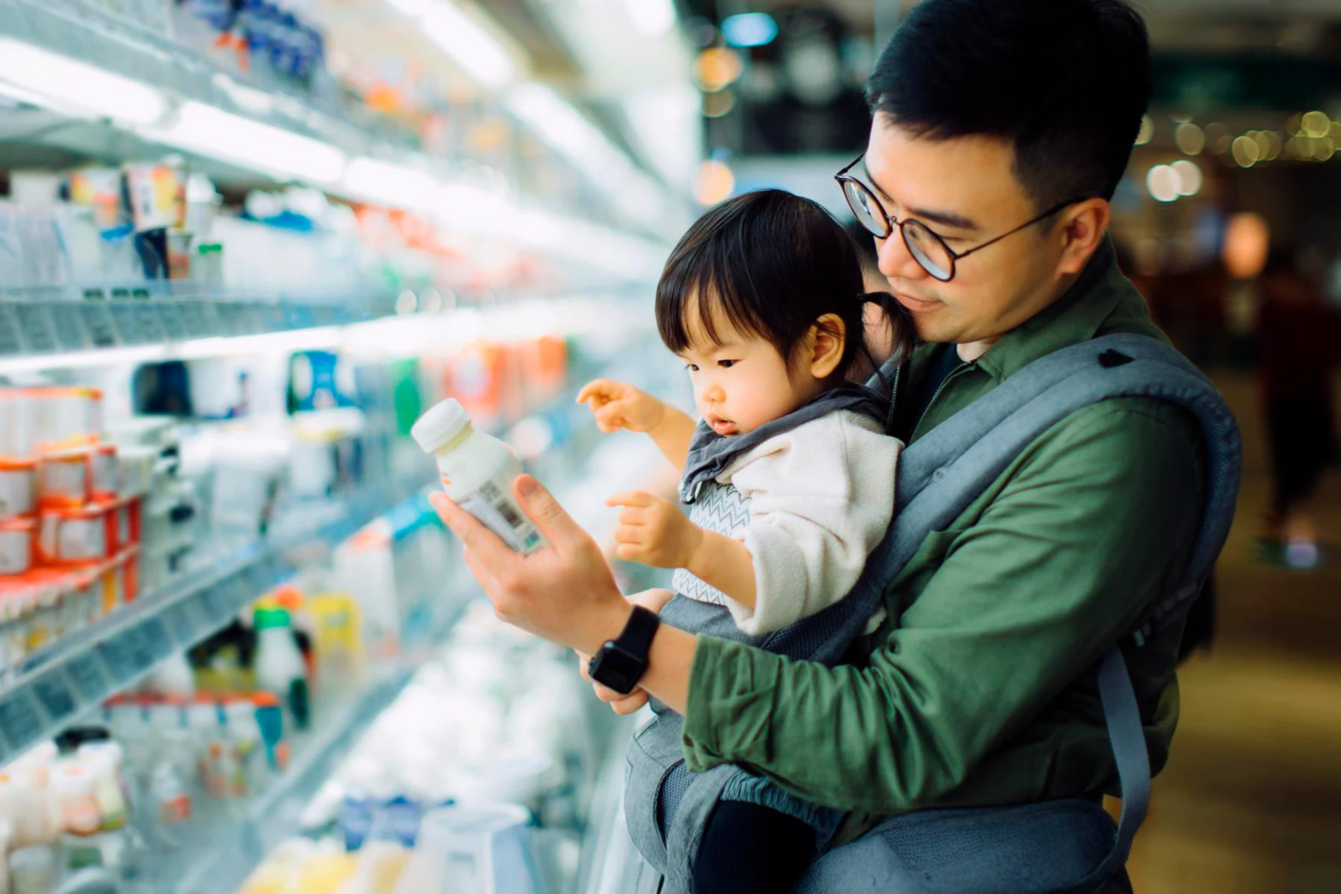 father and daughter shopping for dairy products