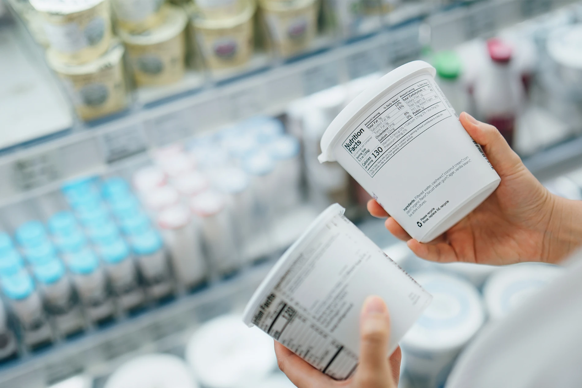 choosing yogurt in supermarket