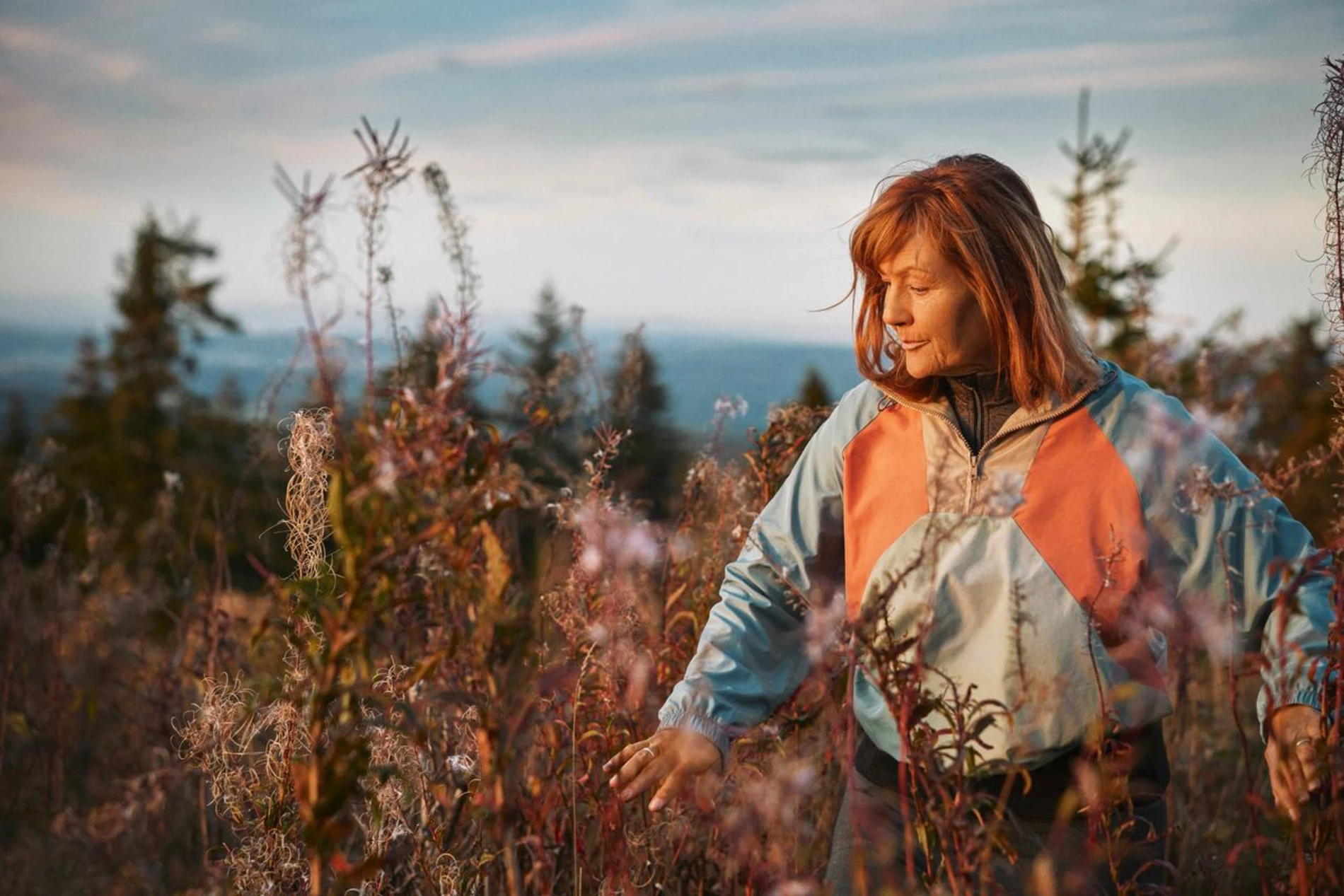 woman walking in meadow