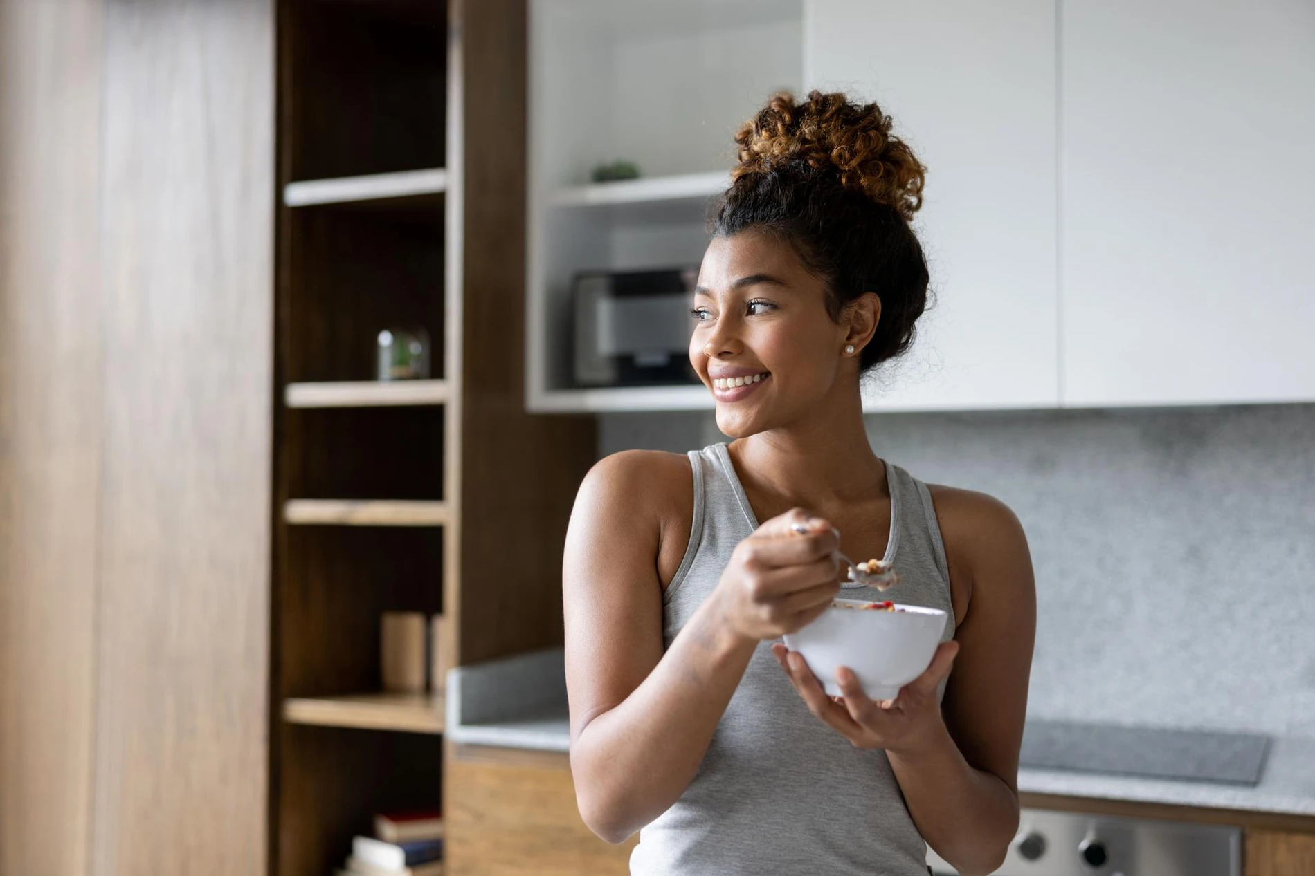 woman eating yogurt fitness