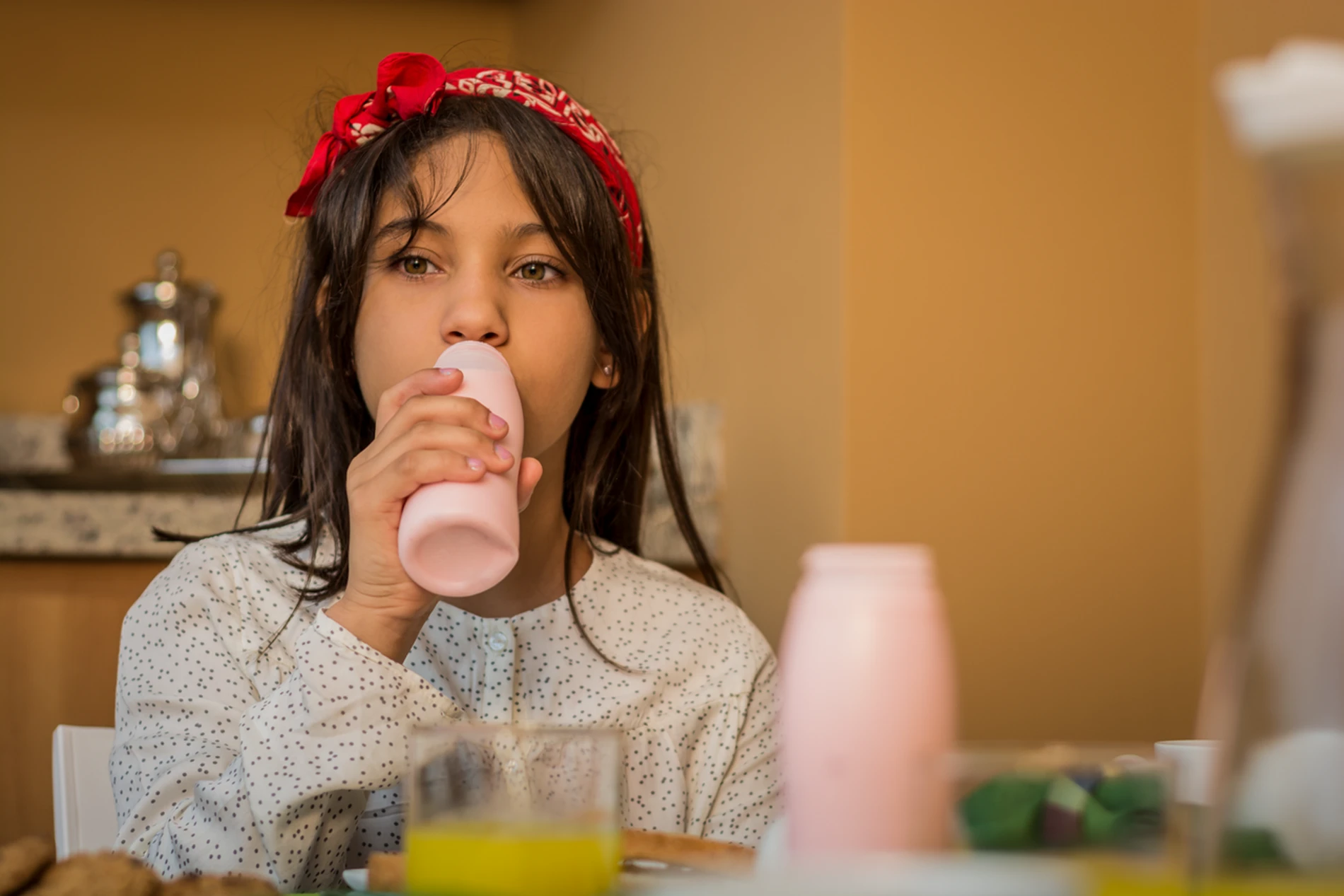 Girl drinking yogurt